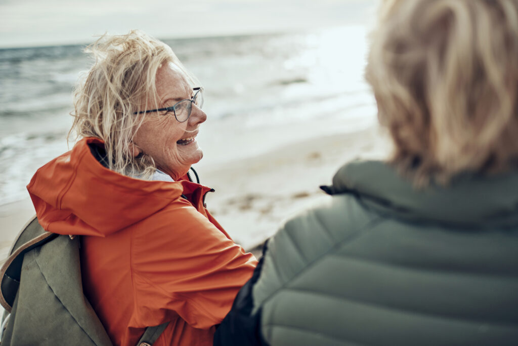 Lady on the beach with friend - PillarCare